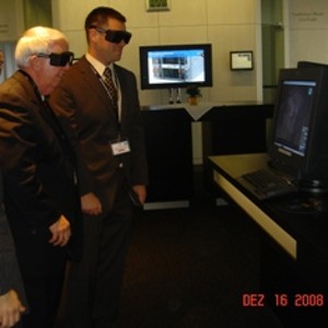 During the IBM tour in December, Dr. Joseph Page Jr., chapter secretary (l), and Capt. John Amann, USAF, use special imaging glasses provided by IBM to view a live beating heart.